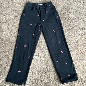 Black PacSun jeans with rose appliqués